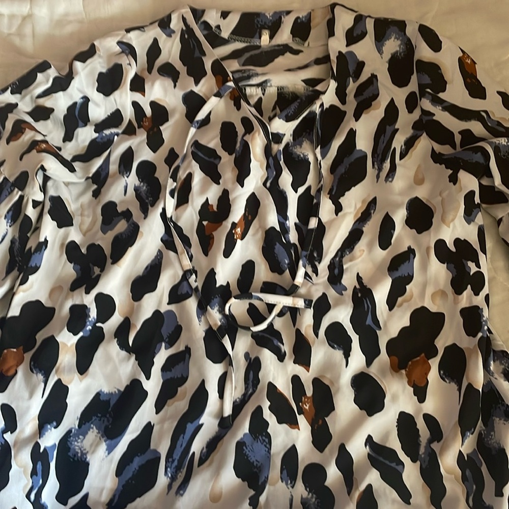 A SHEIN blouse in animal print in size small
